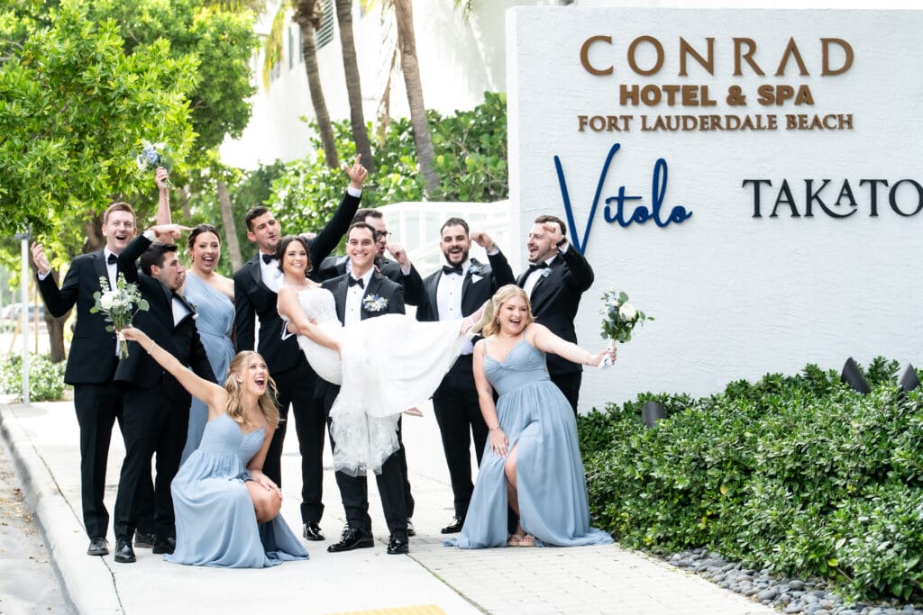 Ellie and Spencer with their wedding party at Conrad Fort Lauderdale Beach