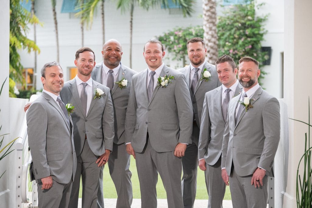 Trevor and his groomsmen gathered  in grey suits at the Pelican Club, Jupiter